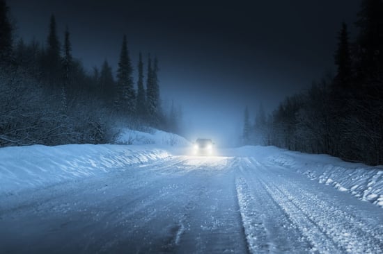 Car lights in winter Russian forest-1