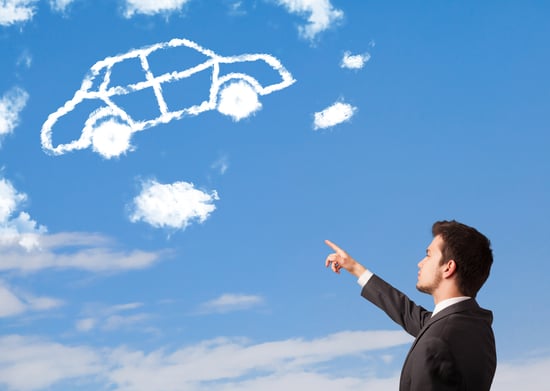 Handsome young man looking at car cloud on a blue sky