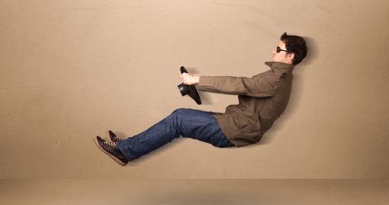 Happy funny man driving a flying car concept on background