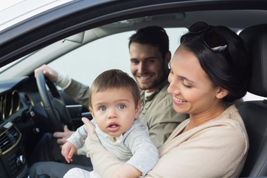 Parents and baby on a drive in their car