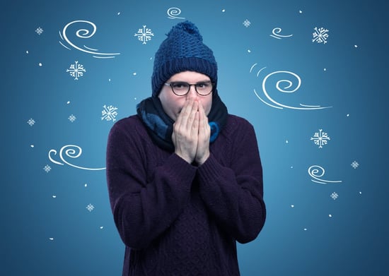 Young hipster frozen boy with doodled snowflakes and windy concept