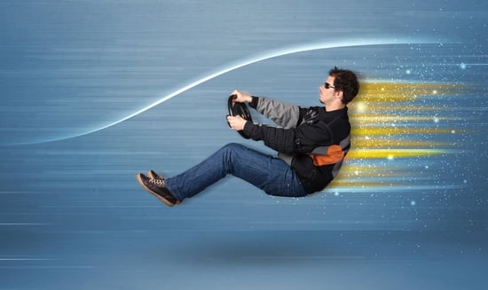 Young man driving in imaginary fast car with blurred lines concept