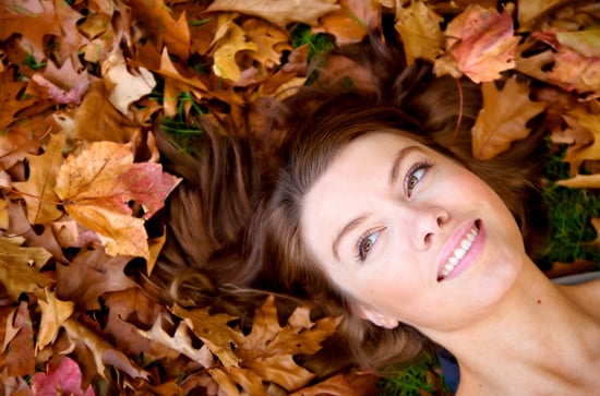 autumn girl portrait on the floor smiling